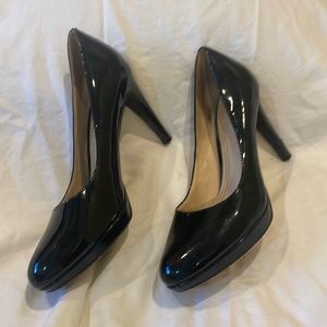 Cole Haan black patten high heels.